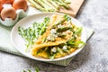 Gourmet Tasty Egg Omelette with Asparagus and soft Cheese. Asparagus. Fresh Asparagus with eggs Royalty Free Stock Photo