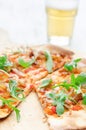 Gourmet thin crust pizza with fresh rocket and caramelised onion Royalty Free Stock Photo