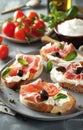 Gourmet Tomato and Prosciutto Bruschetta With Olives and Basil on a White Plate Royalty Free Stock Photo