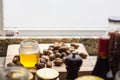 Gourmet walnut oil and delicious nuts are on a wooden table Royalty Free Stock Photo