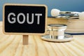 Gout disease. Book and stethoscope Royalty Free Stock Photo