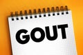 Gout - form of inflammatory arthritis that is very painful, text concept on notepad Royalty Free Stock Photo