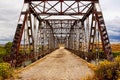 Looking Across the Old Steel Government Bridge over the North Platte River in Southern Wyoming. Royalty Free Stock Photo