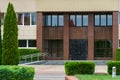 A government building with large glass windows and doors. Modern office building. Architecture and facade of the building