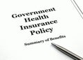 Government Health Insurance Policy and Pen Royalty Free Stock Photo