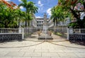 The Government House of Mauritius, with statue of Queen Victoria behind the main gate Royalty Free Stock Photo