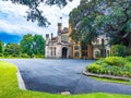 Government House of Sydney, Australia, surrounded by lush and vibrant greenery. Royalty Free Stock Photo