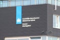 Government logo and names of the Dutch Militairy police Marechaussee and customs on building at Rotterdam The Hague Airport