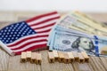 Government Shutdown USA concept with American flag and money bills on white background and wooden board