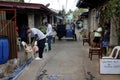 Government workers put relief goods on chairs in front of homes during the Covid 19 virus outbreak