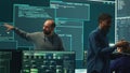 Governmental hackers analyzing cyber threats on big screens