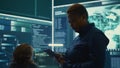 Governmental hackers working on computer network in high tech office