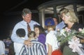 Governor Bill Clinton embraces a group of children at Tyler Junior College on the Clinton/Gore 1992 Buscapade campaign tour in