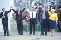 Governor Bill Clinton joins hands at Arneson River during the Clinton/Gore 1992 Buscapade campaign tour in San Antonio, Texas