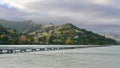 Governors Bay jetty and Port Hills in the background in Christchurch