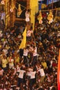 Govindas, young boys surrounded by crowd, making a human pyramid to break Dahi Handi