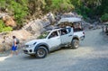 Tourists ride in car along mountain road in Goynuk Canyon, Turkey