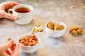 Gozinaki bars Georgian Christmas confection made of sunflower seeds and honey. Peanuts in sugar in white bowl and on gray Royalty Free Stock Photo