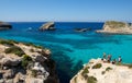 Gozo,Comino island,Maltese coastline with the cliffs,gold rocks over the sea in Malta island with the blue clear sky background Royalty Free Stock Photo