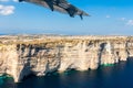 Gozo island from above, under the wing of a small plane. Aerial view of Gozo, Malta. Rotunda of Xewkija or Casal XeuchiaÃÂ§.