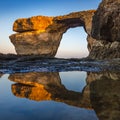 Gozo, Malta - Sunriseat the beautiful Azure Window with reflection Royalty Free Stock Photo