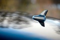 GPS antenna shark fin shape on a roof of german car for radio navigation system with drops of water Royalty Free Stock Photo