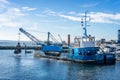 Grab Dredger C H Horn at work dredging Poole Harbour marina in Dorset, UK Royalty Free Stock Photo