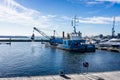 Grab Dredger C H Horn at work dredging Poole Harbour marina in Dorset, UK