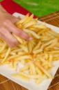 Grabbing french fries Royalty Free Stock Photo