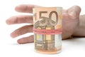 Grabbing a Roll of Money Royalty Free Stock Photo