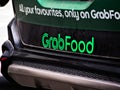 GrabFood Logo At The Tailgate Of A Vehicle
