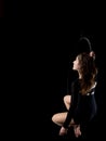 Graceful aerial dancer woman on black