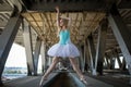 Graceful ballerina in the industrial background