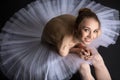 Graceful ballerina sitting on the floor Royalty Free Stock Photo