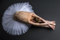 Graceful ballerina sitting on the floor Royalty Free Stock Photo