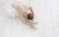 Graceful Ballerina stretching, ballet background, top view Royalty Free Stock Photo