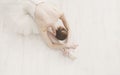 Graceful Ballerina stretching, ballet background, top view Royalty Free Stock Photo