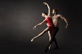 Ballet Dancers. Modern Ballerina Couple Posing over Gray Background Royalty Free Stock Photo