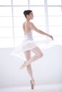 Graceful beauty. Graceful young ballerina in white dancing en pointe. Royalty Free Stock Photo