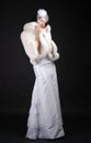 Graceful bride wrapping up in fur coat.