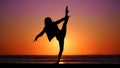 Graceful Dancer Silhouette at Sunset Beach Royalty Free Stock Photo