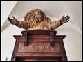 Graceful Entrance: Statue of a Man Embracing an Ancient Monument in BesanÃÂ§on, France Royalty Free Stock Photo