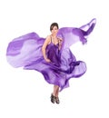 Graceful girl in flying purple silk dress