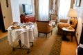 Graceful hospitality. Luxurious Room Service. Breakfast in luxury hotel room delivered by waiter. Hospitality and
