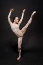 Graceful principal ballet dancer performing the twine