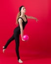 Graceful slim girl in black leotard do gymnastics Royalty Free Stock Photo
