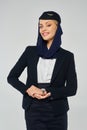graceful stewardess of arabian airlines with Royalty Free Stock Photo