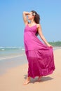 Graceful woman walking at the beach