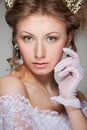 Graceful woman in white gloves