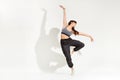 Graceful young woman dancer performing a classic dance pose Royalty Free Stock Photo